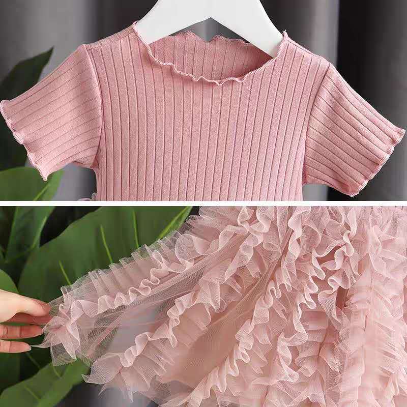 Girls' tiered cotton dress shown full length on a child