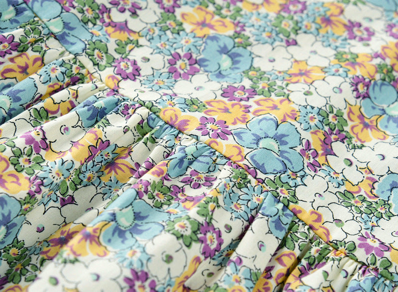Green floral cotton dress for girls shown on a child