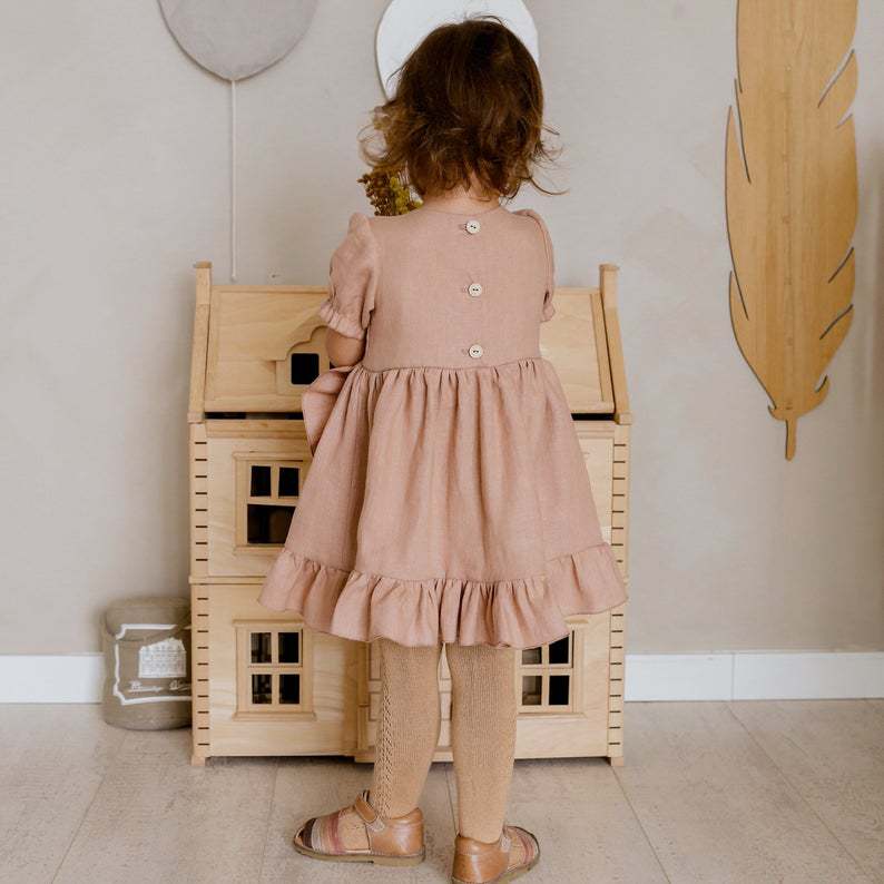 Girls' cotton-linen ruffle dress shown full length