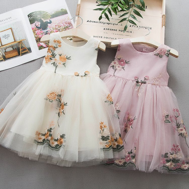 Detail of the skirt and hem on the Marktox girls' embroidered cotton sundress