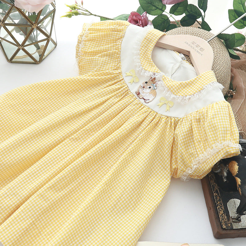 Detail of the bodice on the Marktox girls' yellow plaid embroidered dress