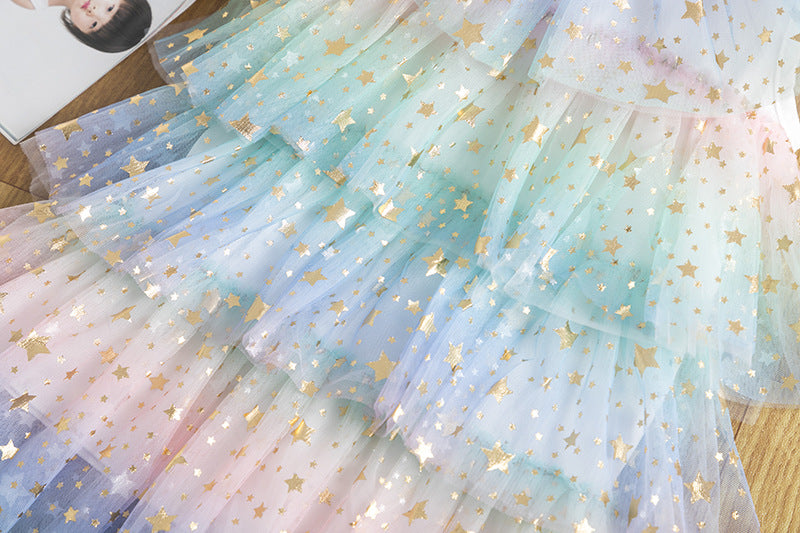 Detail of the tiered mesh skirt on the Marktox girls' party dress