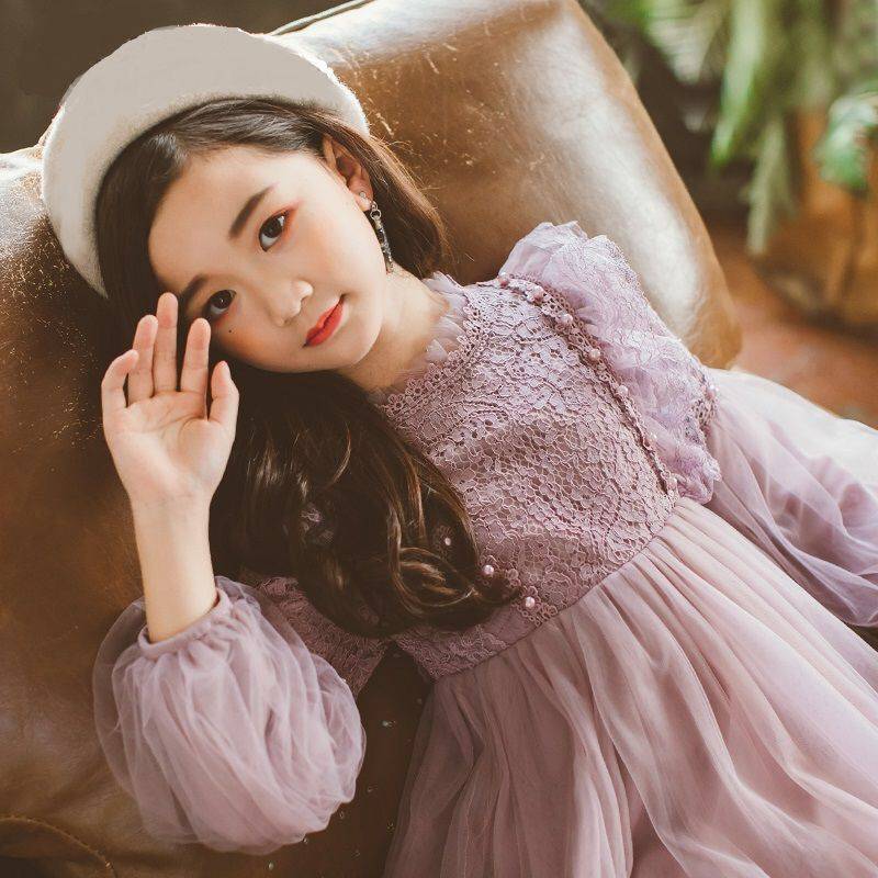 Detail of the skirt and hem on the Marktox girls' long-sleeve lace dress