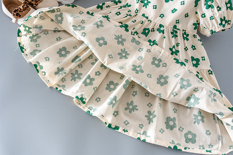 Detail of the pleated skirt on the Marktox girls' green floral dress