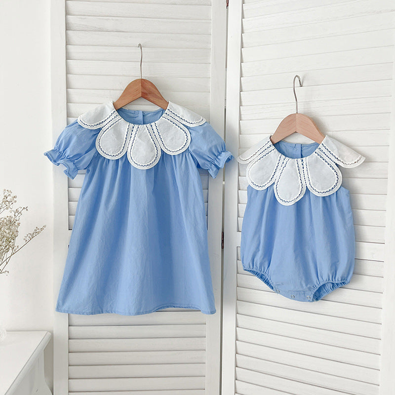 Detail of the cotton fabric and neckline on the Marktox girls' sleeveless dress