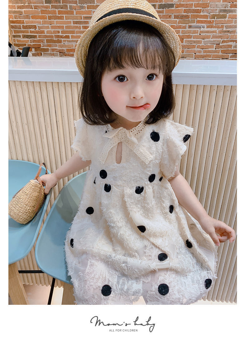 Girls' off-white cotton dress shown full length